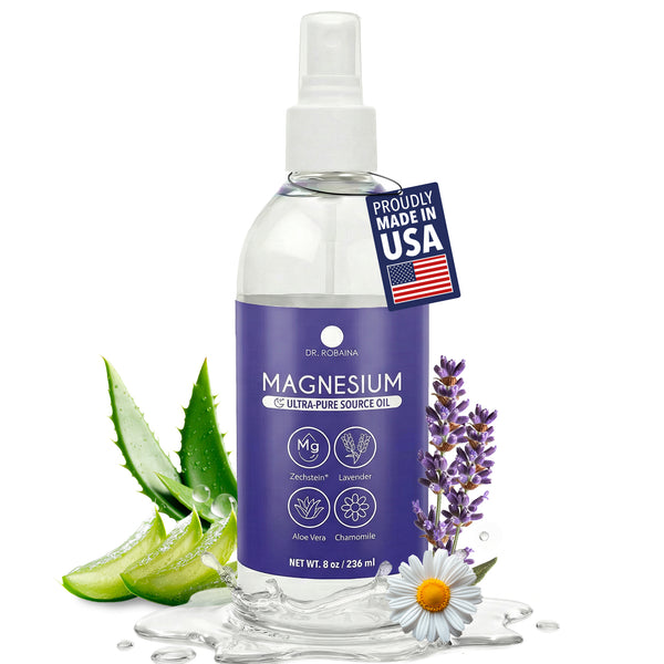 Bottle of magnesium oil with a purple label, surrounded by aloe vera, lavender, and a daisy on a white background.